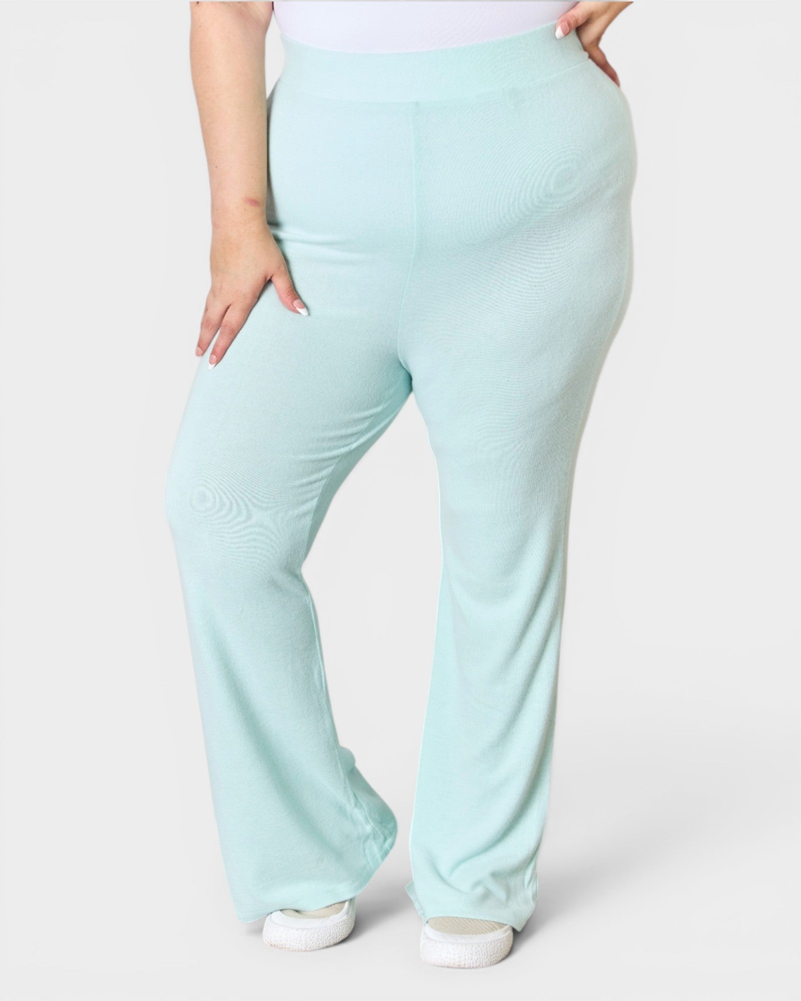 Light blue pants worn by a person on a white background
