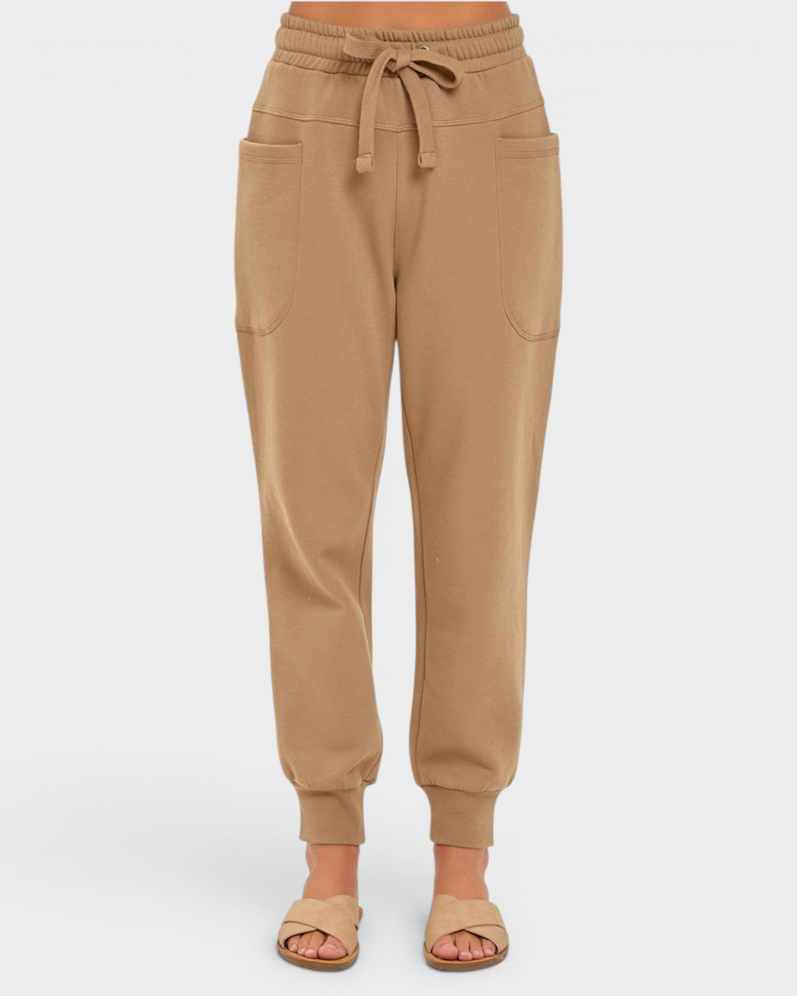 Tan jogger pants on a white background