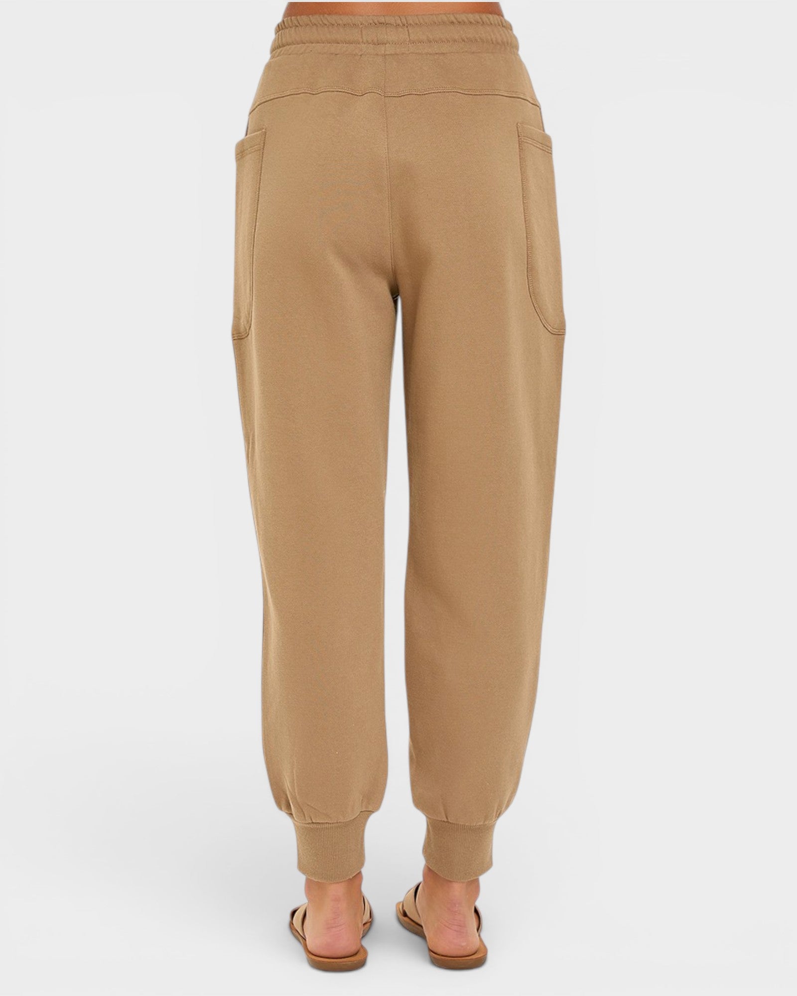 Tan sweatpants on a white background