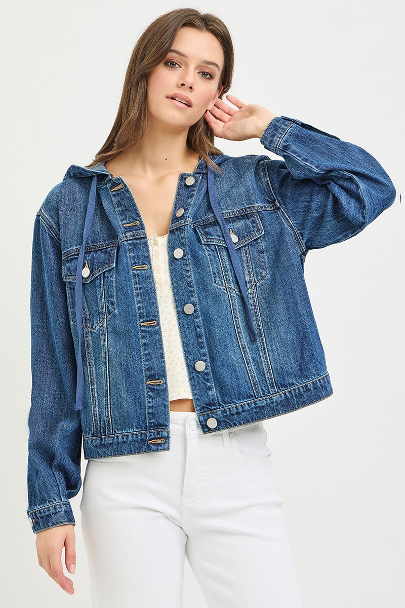 Woman wearing a blue denim jacket on a white background