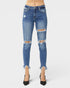 Blue distressed jeans on a white background