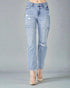 Light blue distressed jeans on a gray background