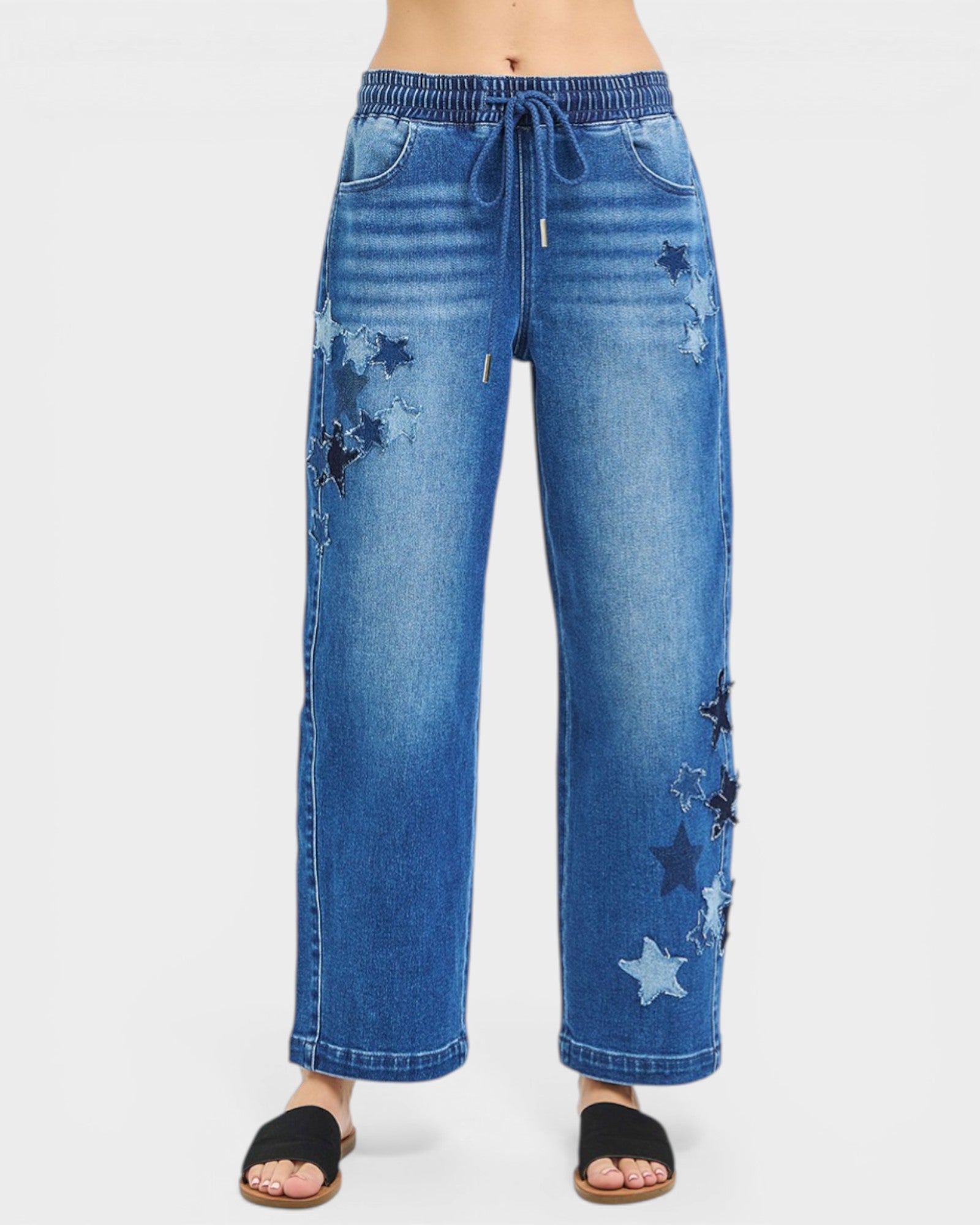 Blue jeans with star patterns on a white background