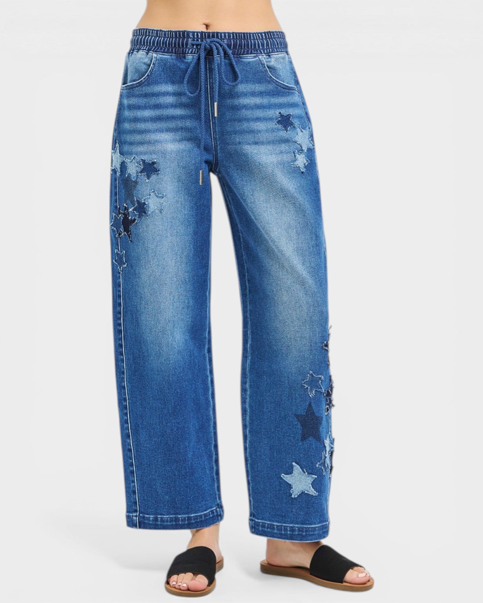 Blue jeans with star patterns on a white background