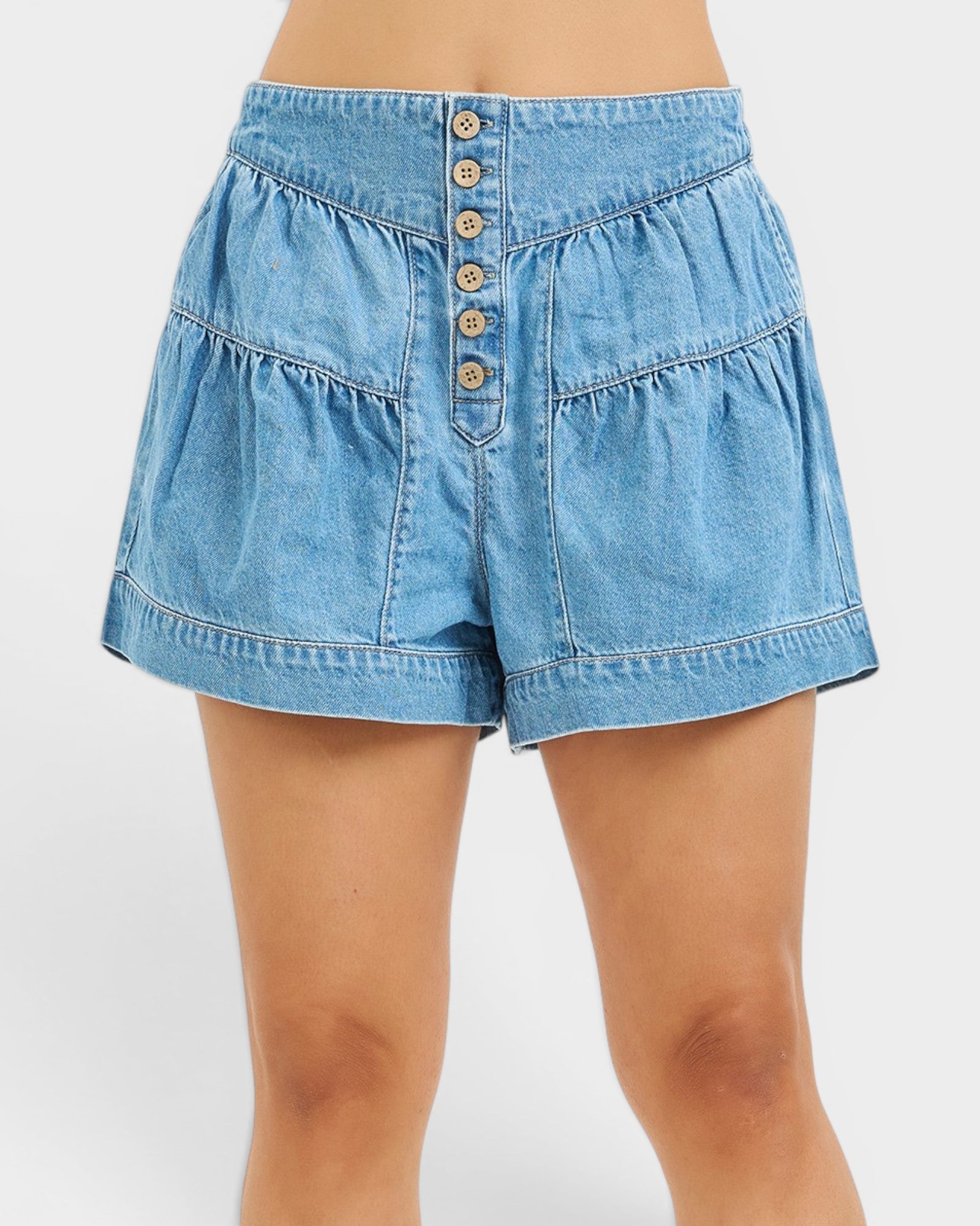 Blue denim shorts with button details on a white background
