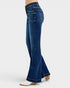 Blue flared jeans worn by a person on a white background