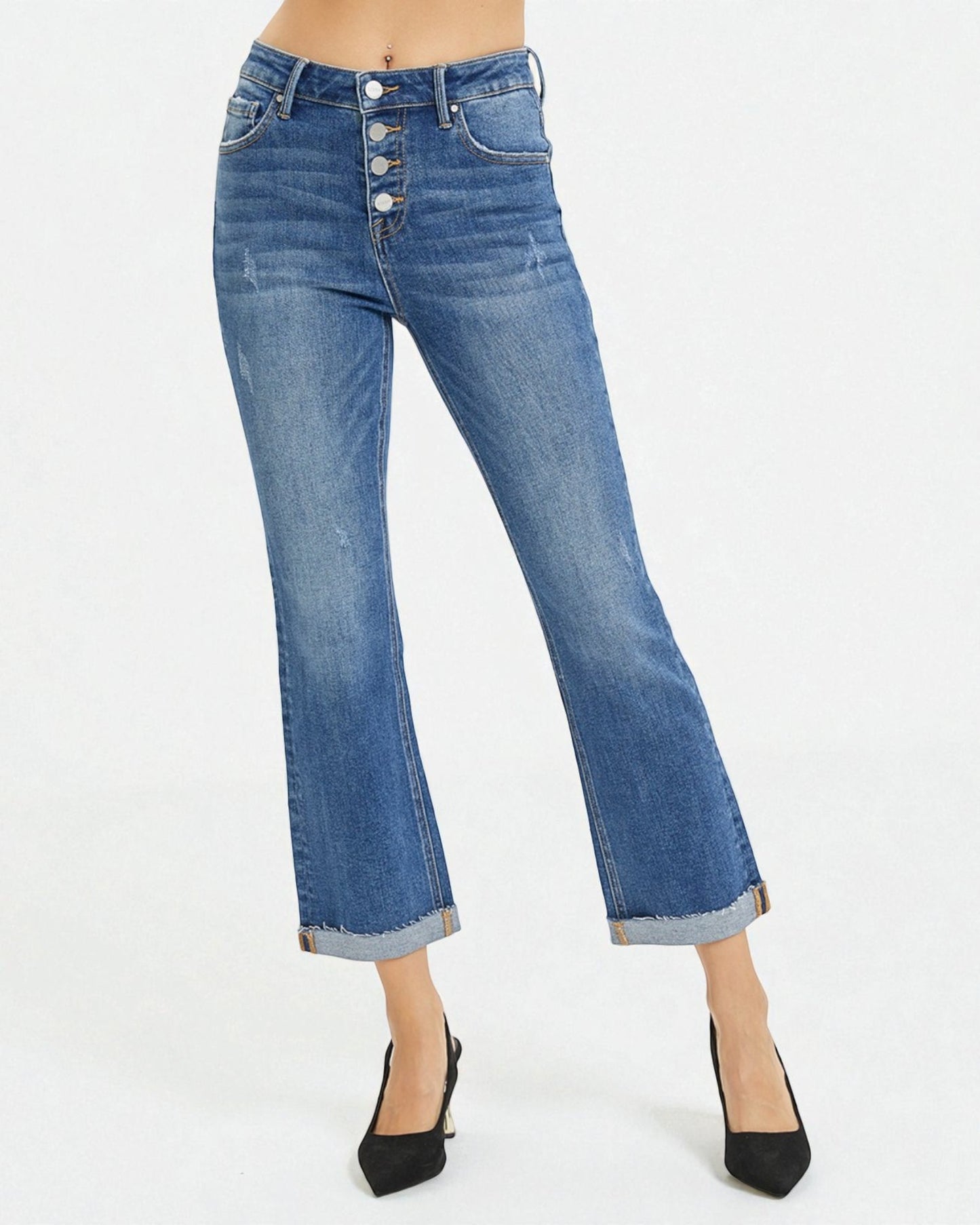 Blue jeans with a button fly on a white background