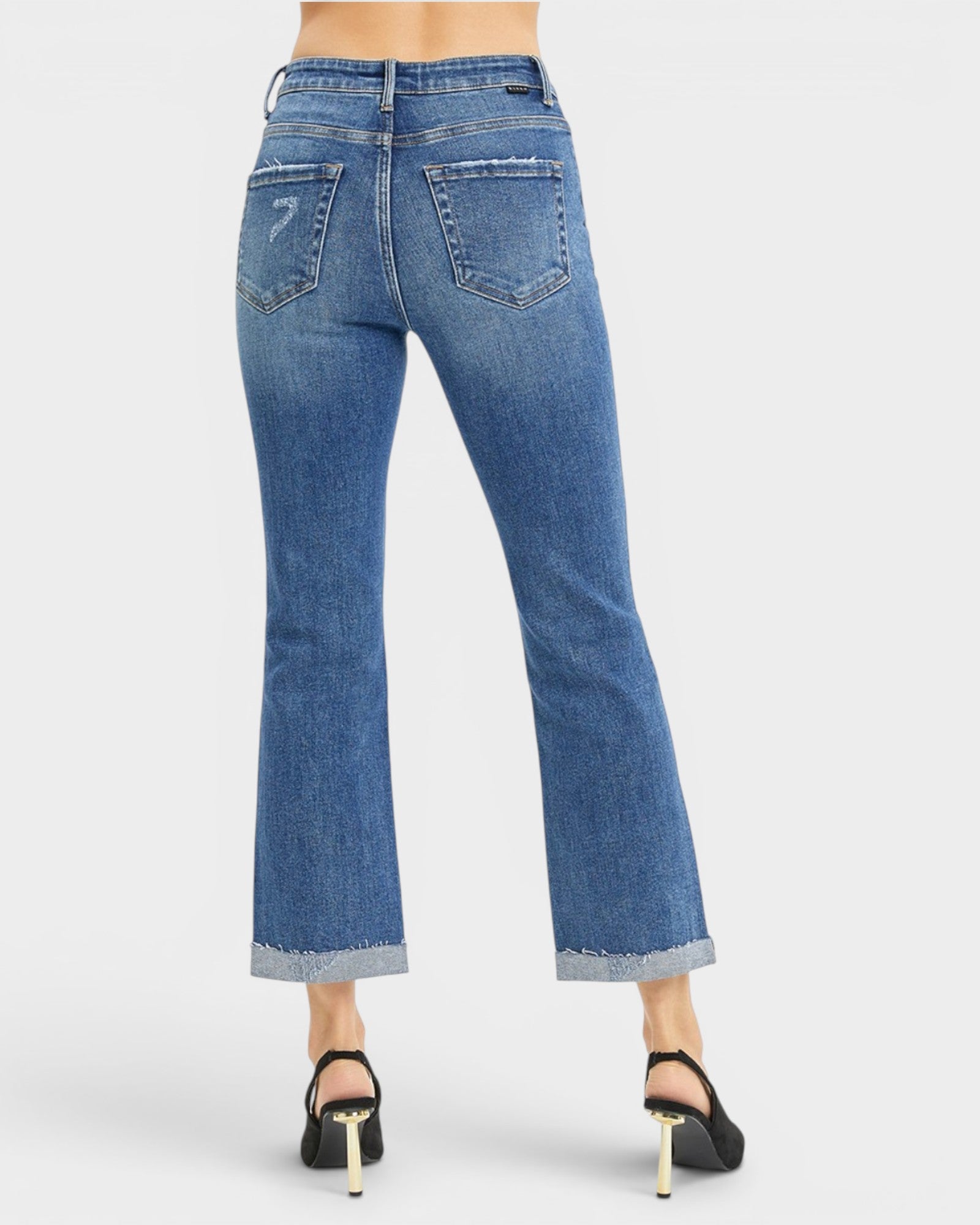 Vaqueros bootcut recortados con bragueta de botones y lavado oscuro