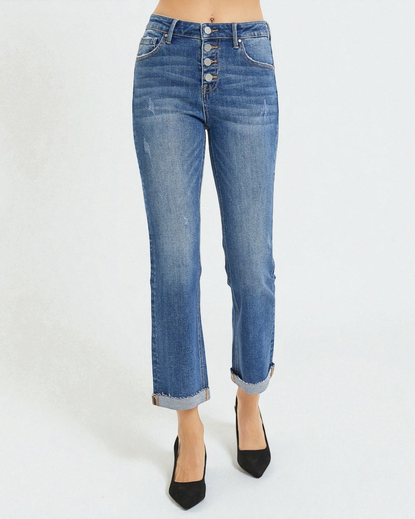 Blue jeans worn by a person on a white background