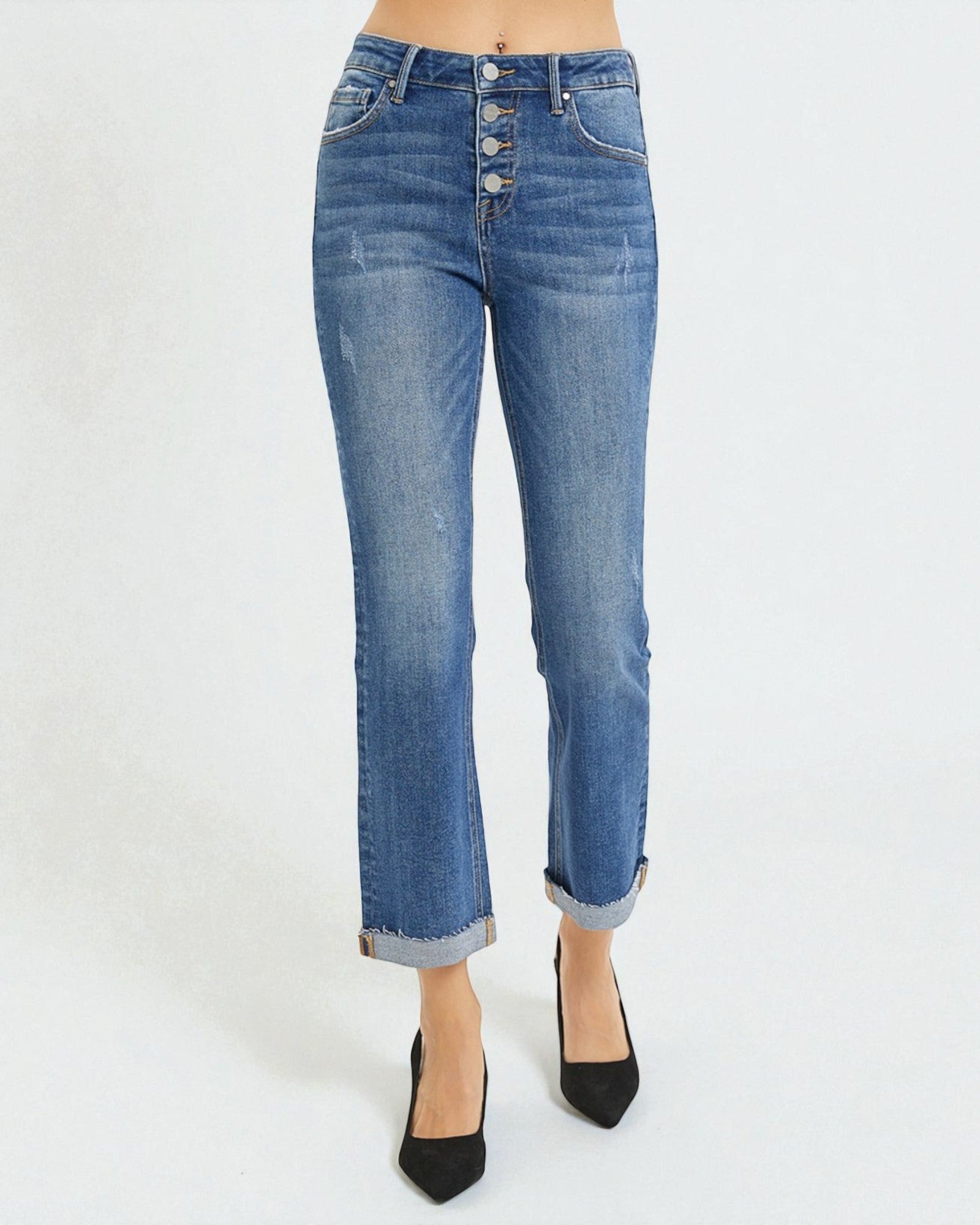 Blue jeans worn by a person on a white background