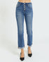 Blue jeans worn by a person on a white background