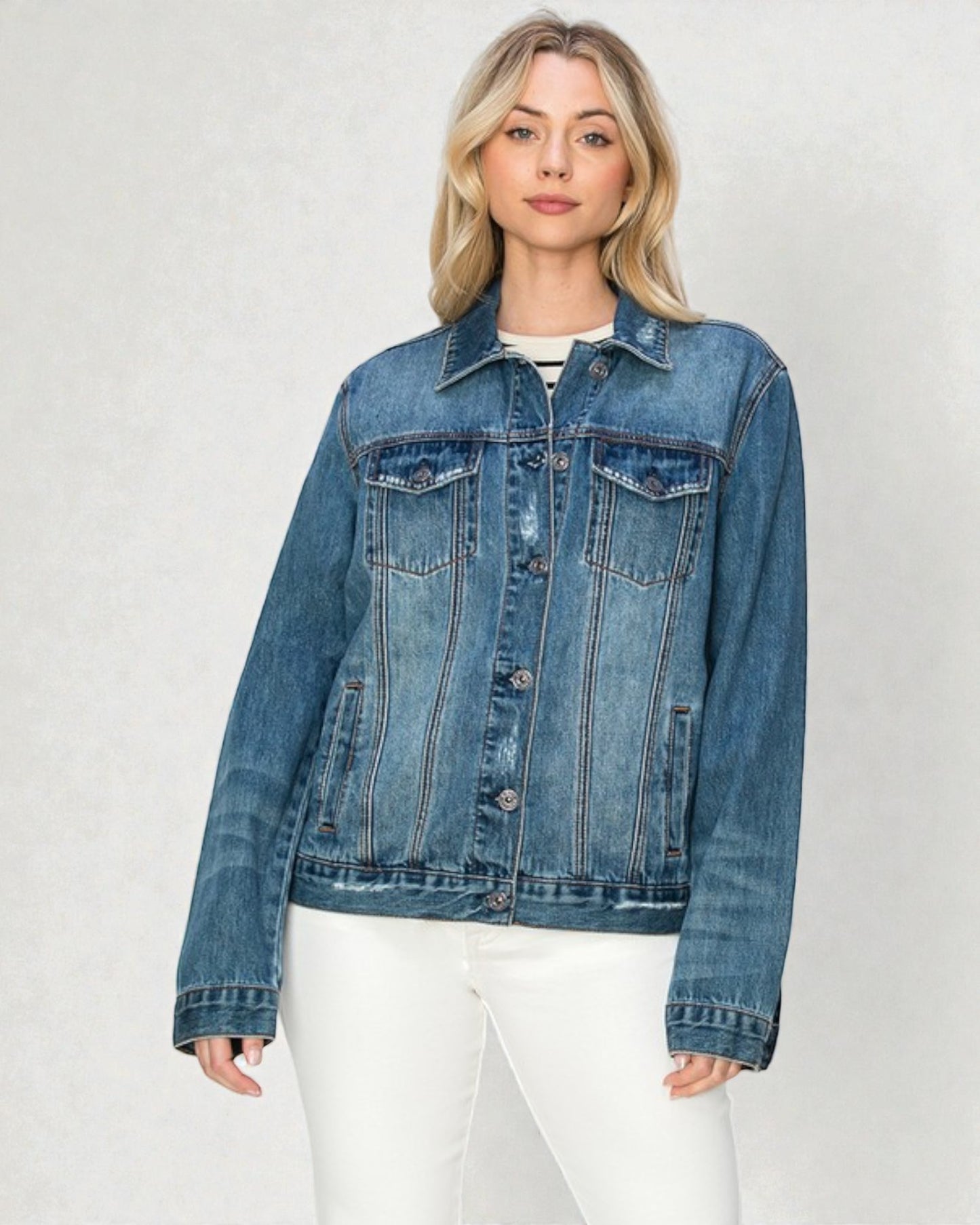 Woman wearing a blue denim jacket on a white background