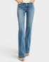 Blue jeans worn by a person on a white background