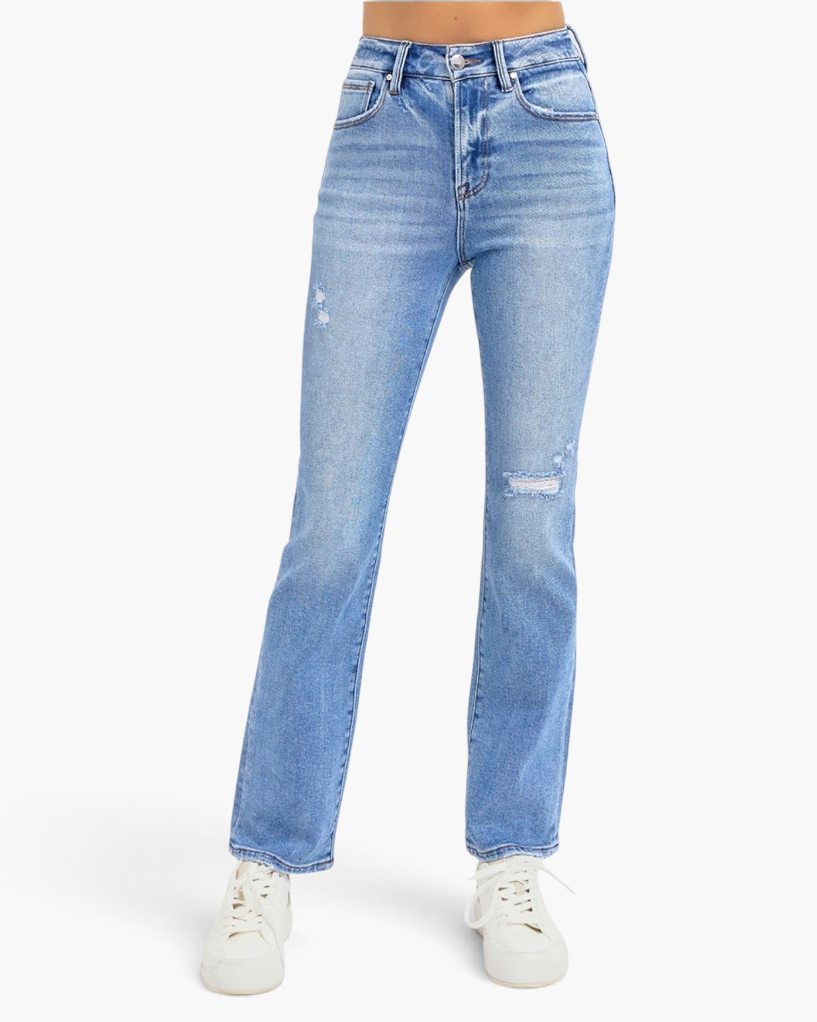 Light wash blue denim jeans with distressed details on the thighs and knees, shown on a model wearing white sneakers against a plain white background.