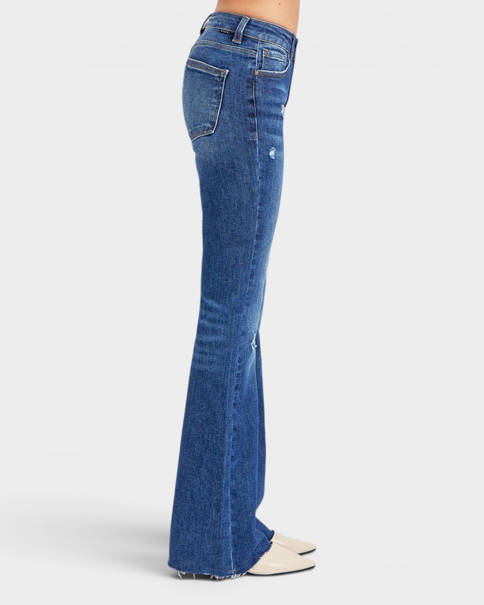 Blue flared jeans on a white background