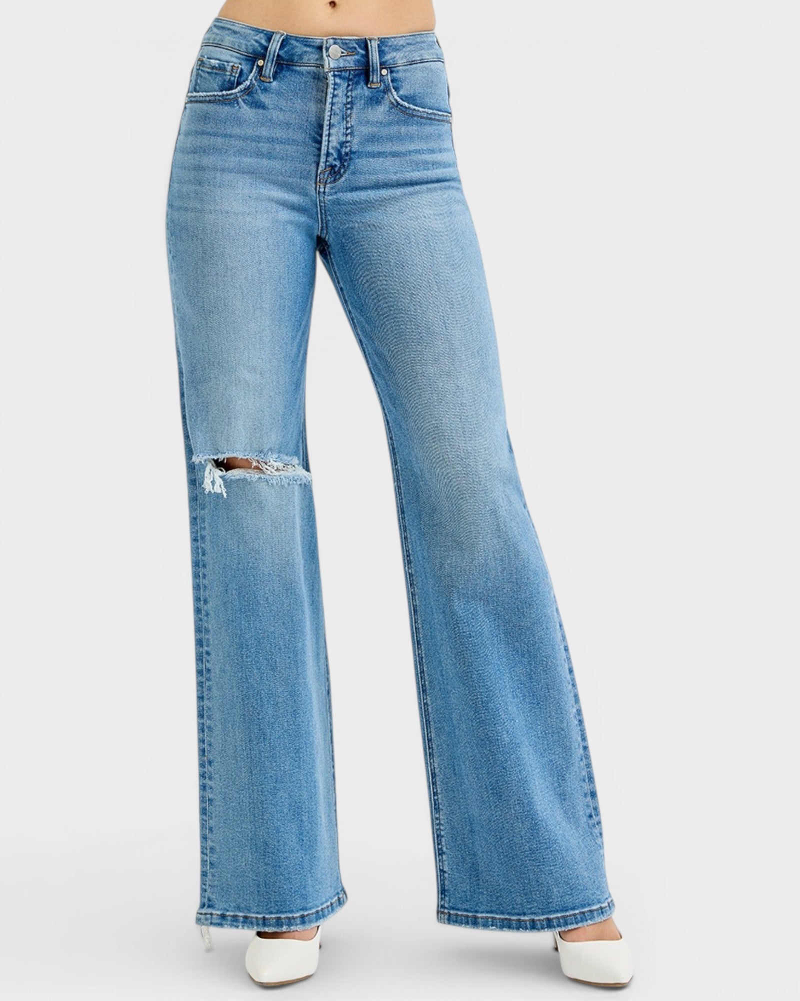 Light blue flared jeans on a white background