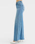 Blue jeans with a high slit on a white background