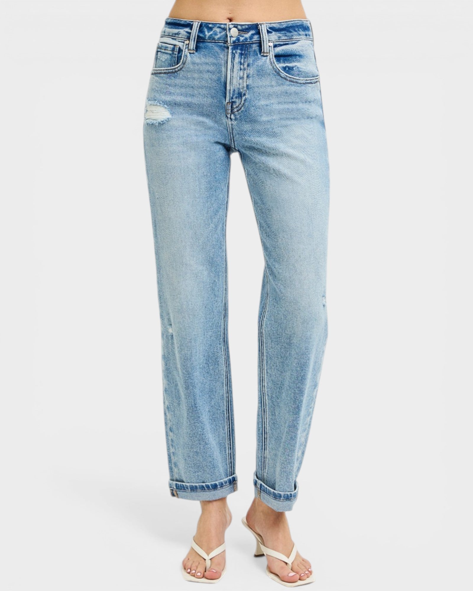 Light blue jeans worn by a person on a white background