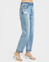 Light blue jeans worn by a person on a white background