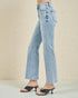 Light blue jeans worn by a person on a beige background