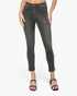 A model wearing dark gray washed skinny jeans with a cropped ankle length, paired with black strappy sandals, shown against a plain white studio background.