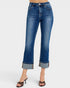 Blue jeans with rolled-up cuffs on a white background