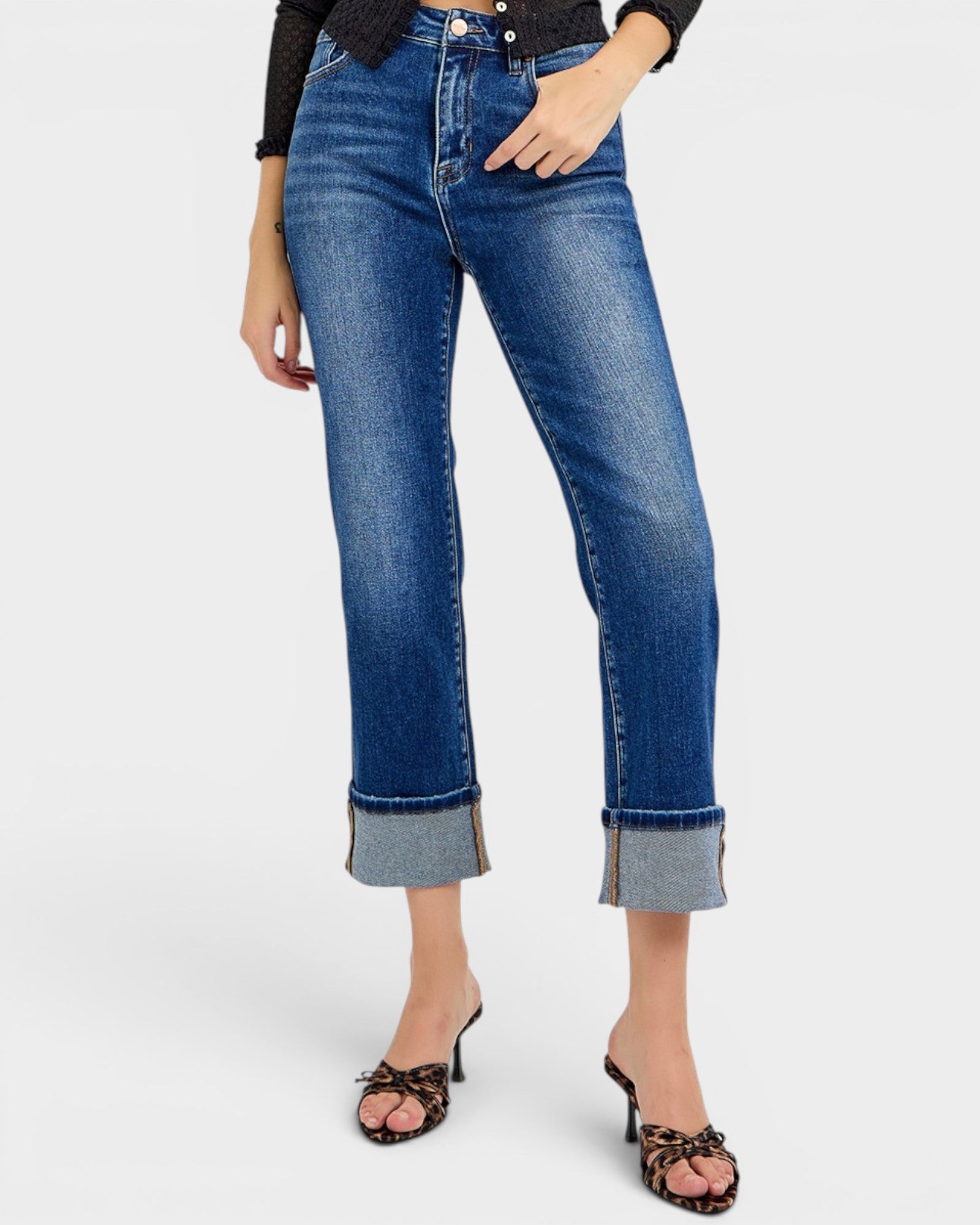 Person wearing blue jeans on a white background