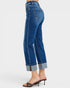 Blue jeans worn by a person on a white background