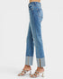 Blue jeans with a distressed hem on a white background