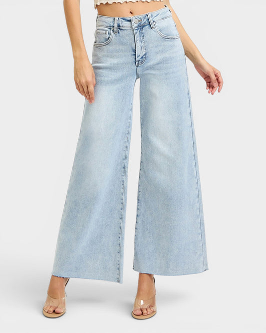 Light blue wide-leg jeans worn by a person on a white background