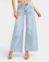Light blue wide-leg jeans worn by a person on a white background