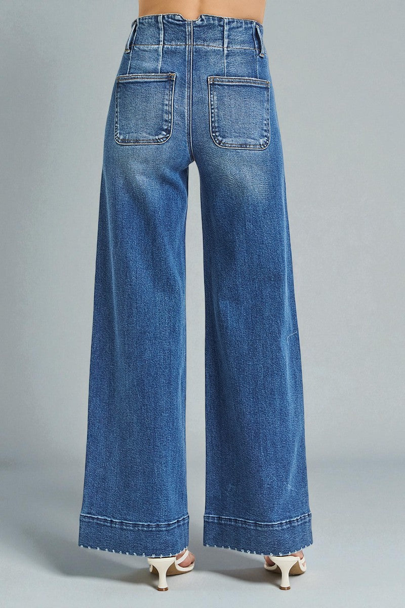 Blue wide-leg jeans on a gray background