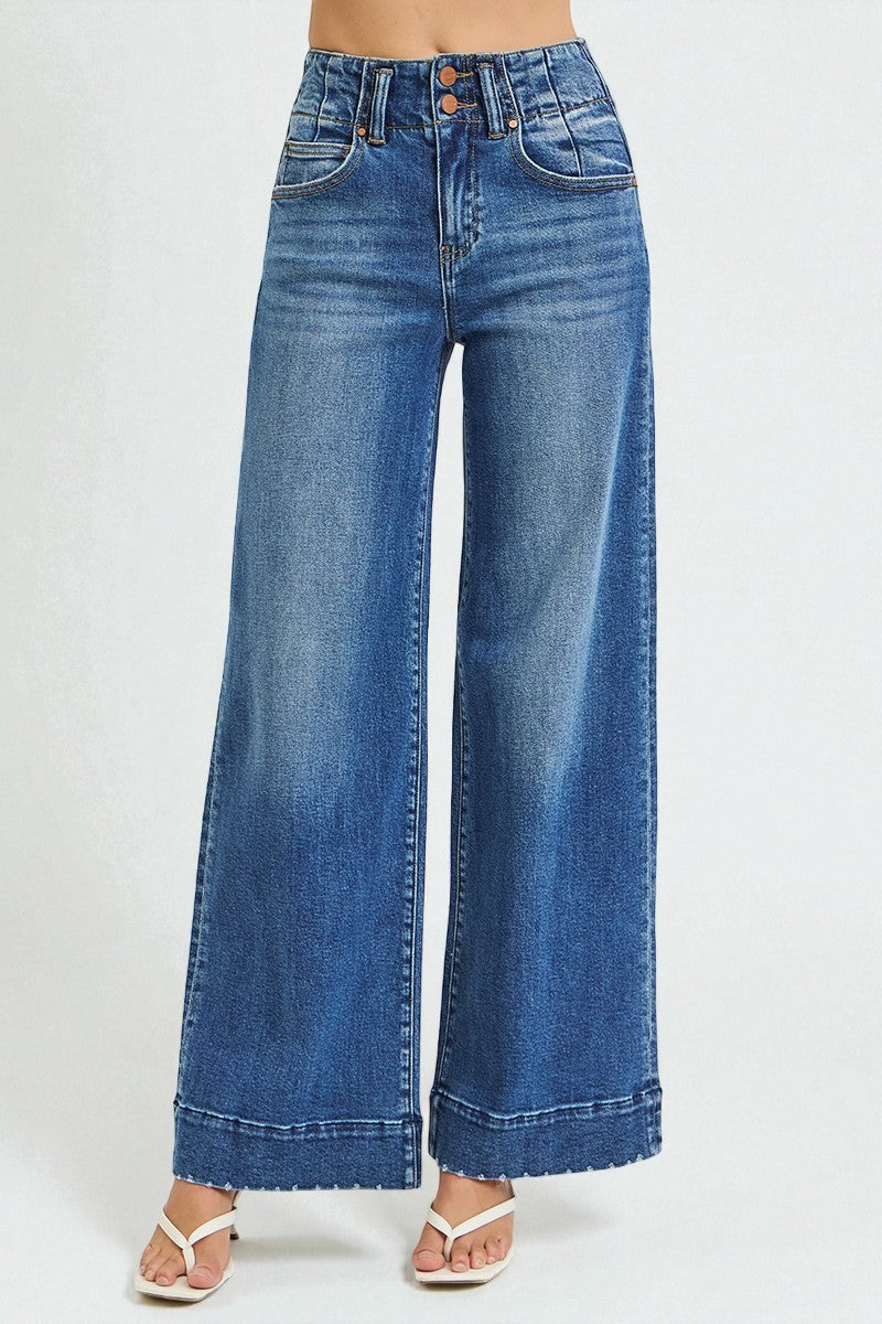 Wide-leg blue jeans on a white background