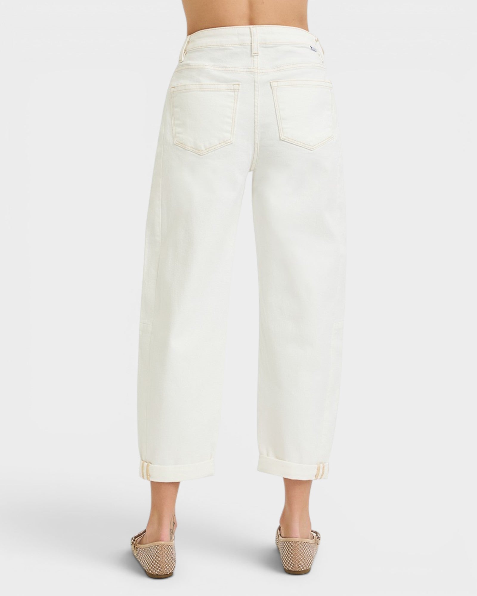 White denim skirt worn by a person on a white background