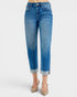 Blue jeans worn by a person on a white background