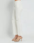 White distressed jeans on a plain background