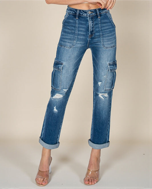 Blue jeans with patchwork design on a beige background