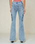 Light blue flared jeans worn by a person on a plain background