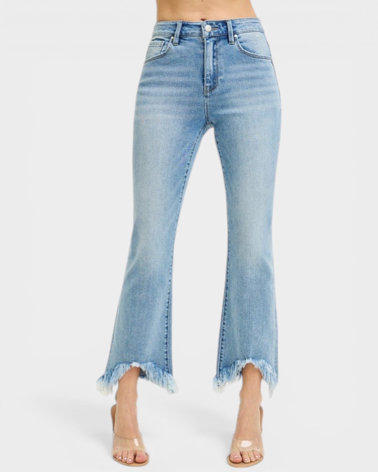 Light blue jeans with a frayed hem on a white background