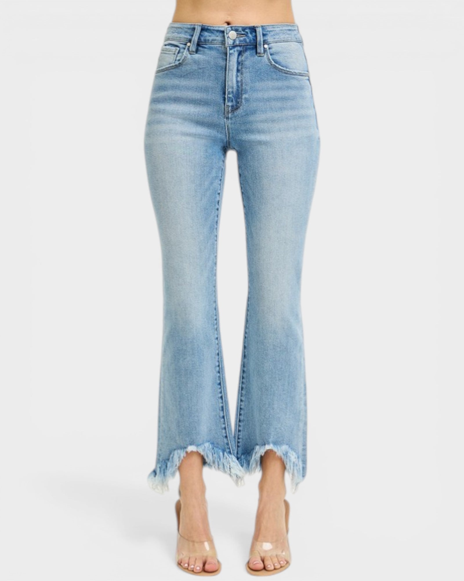 Light blue jeans with a frayed hem on a white background