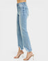 Light blue jeans worn by a person on a white background