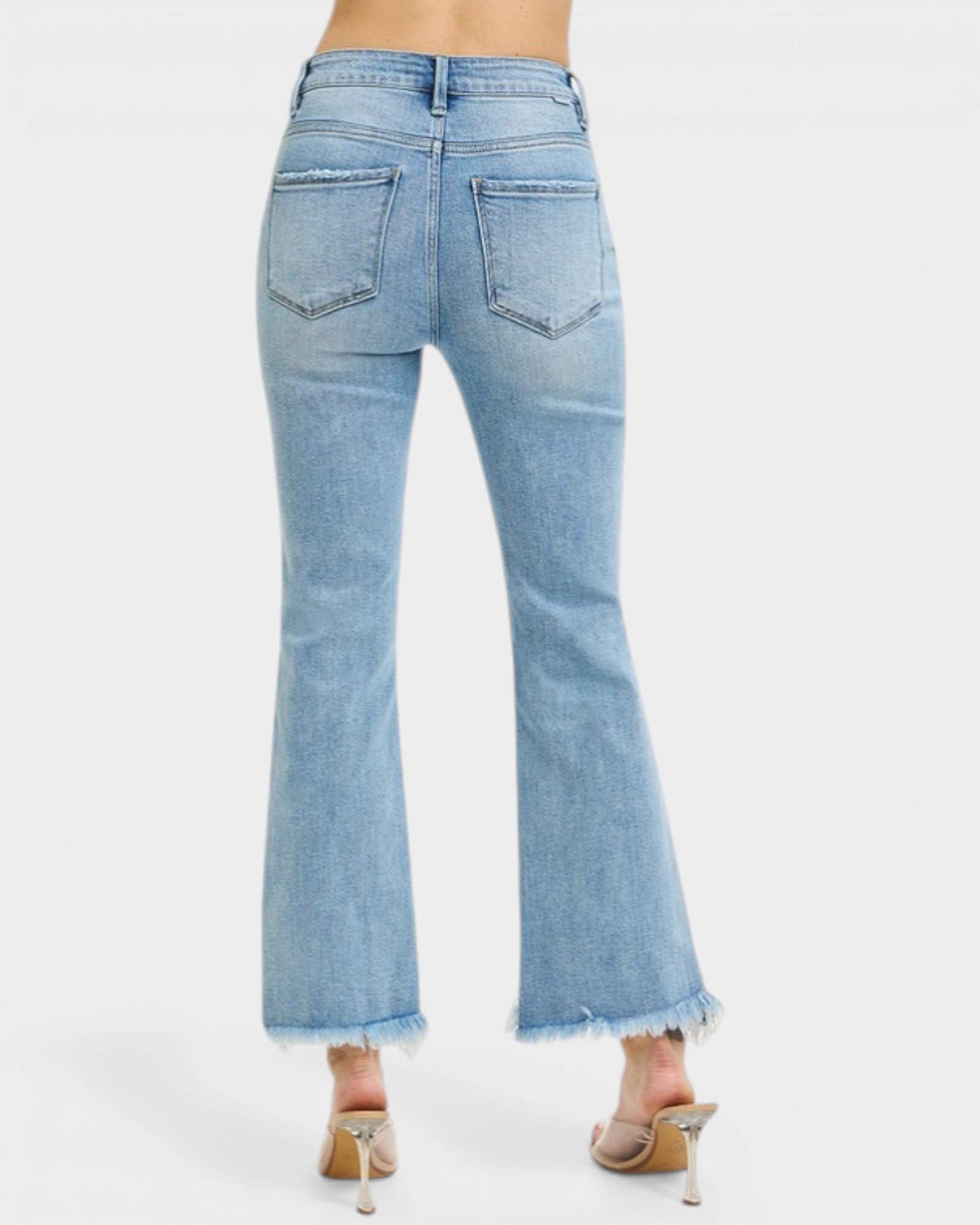 Light blue jeans with a white background