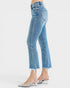 Light blue jeans worn by a person on a white background