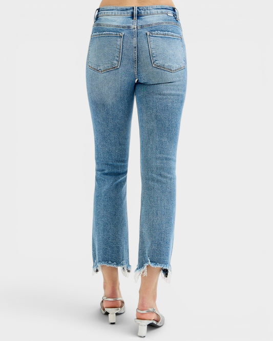 Light blue jeans worn by a person on a white background