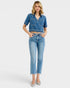 Woman wearing a denim outfit on a white background