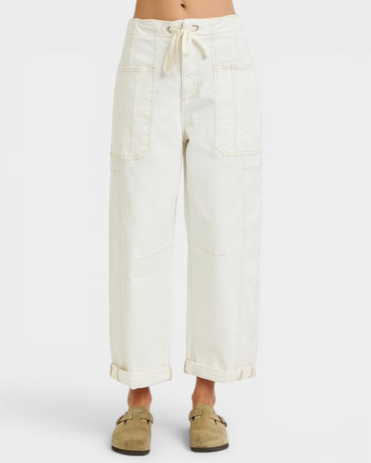 White wide-leg pants worn by a person on a white background