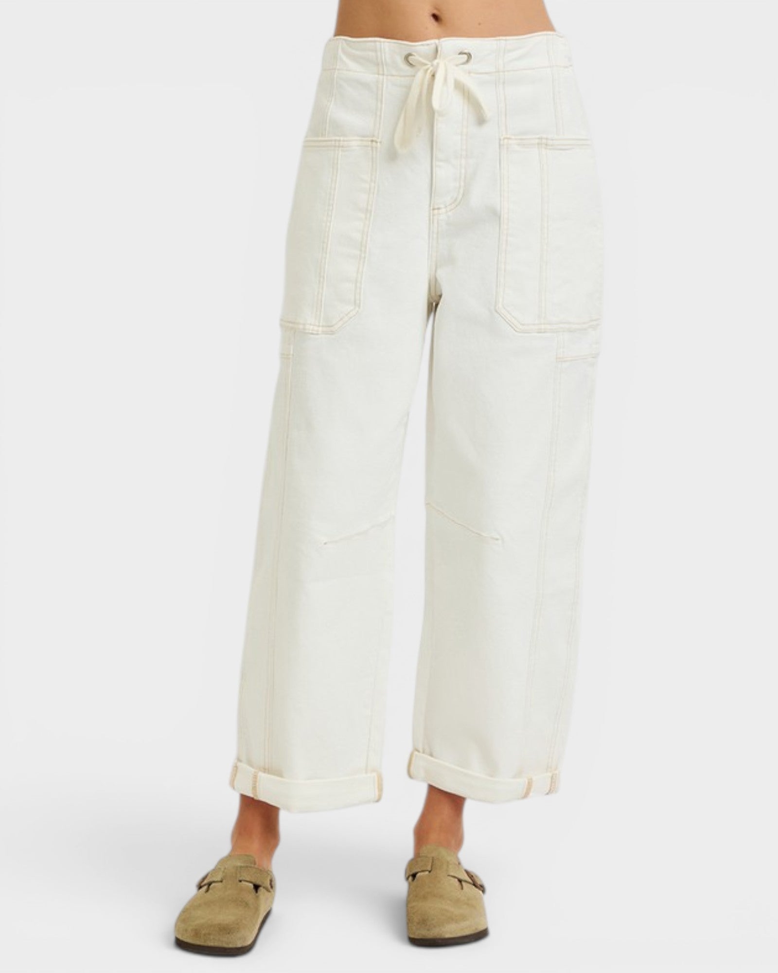 White wide-leg pants worn by a person on a white background