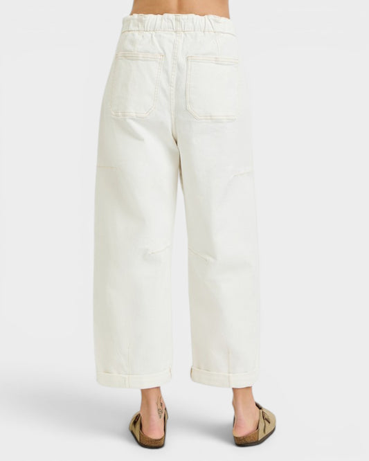 White wide-leg pants worn by a person on a white background