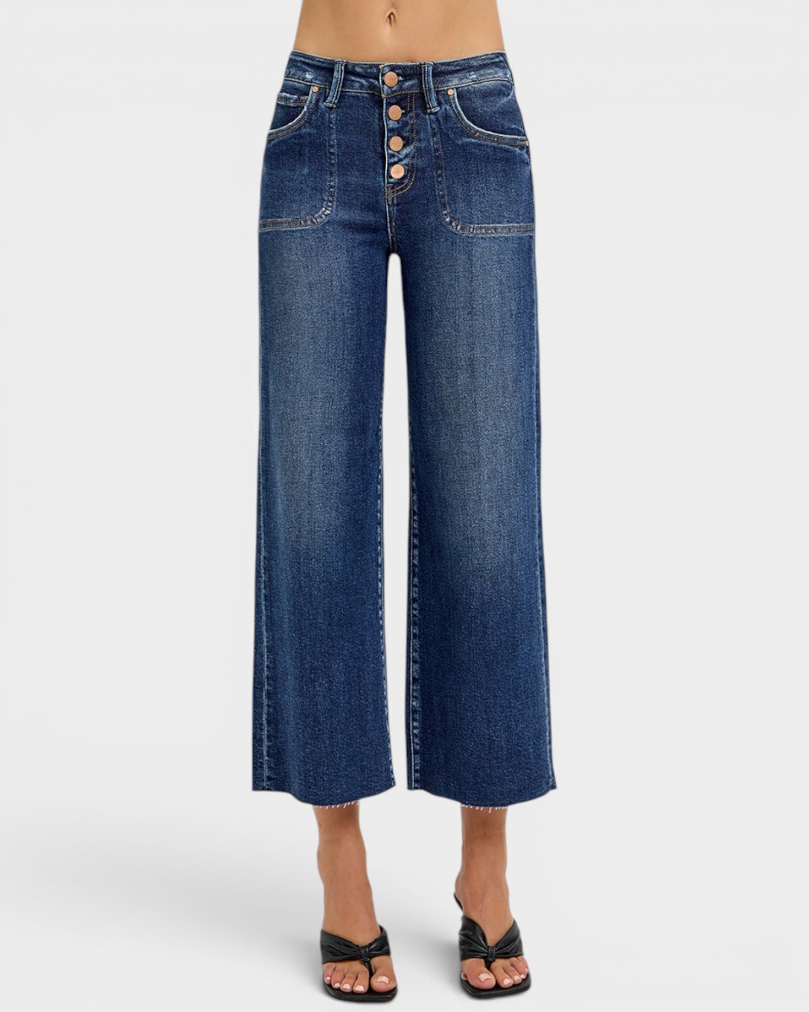 Blue wide-leg jeans on a white background