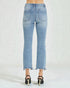 Light blue jeans worn by a person on a white background